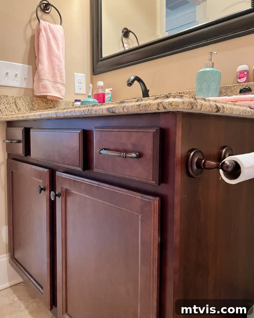 15+ Ingenious DIY Bathroom Renovation Ideas That Won't Break the Bank 3 outdated dark wood bathroom vanity before renovation