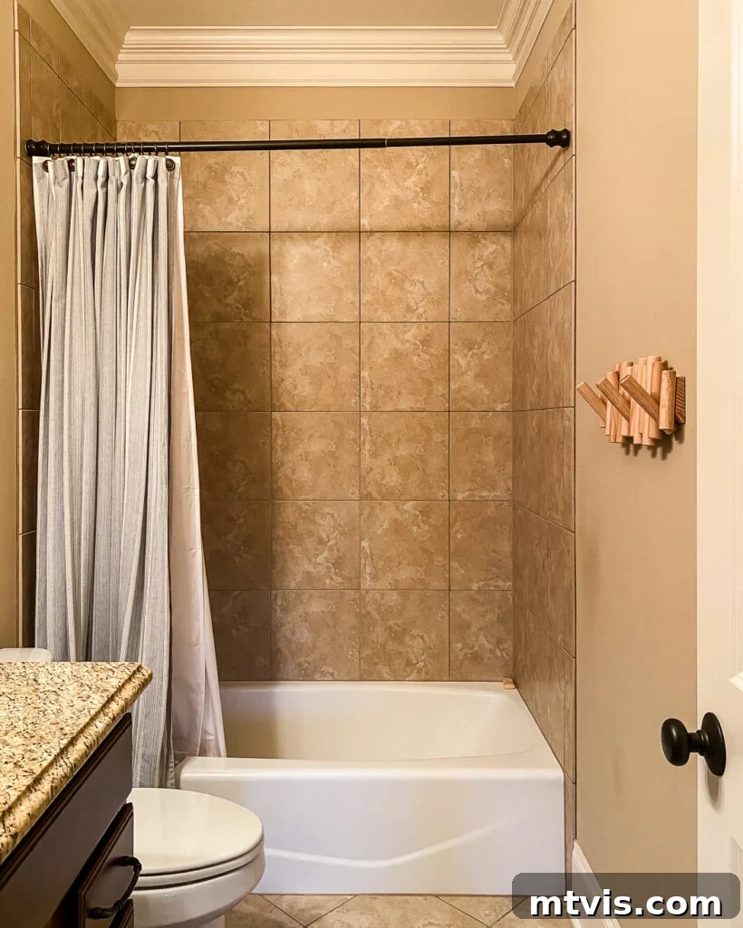 15+ Ingenious DIY Bathroom Renovation Ideas That Won't Break the Bank 20 outdated bathroom with brown tile shower before full-length curtains