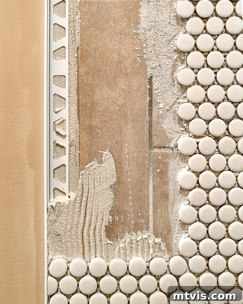 15+ Ingenious DIY Bathroom Renovation Ideas That Won't Break the Bank 25 tiling over existing tile on a shower wall, demonstrating a renovation technique