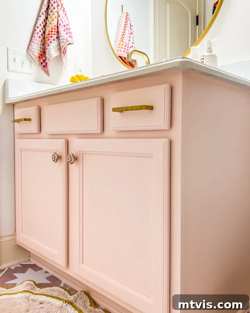 15+ Ingenious DIY Bathroom Renovation Ideas That Won't Break the Bank 4 outdated vanity updated with pink paint and new hardware in girl's bathroom, showing a fresh look
