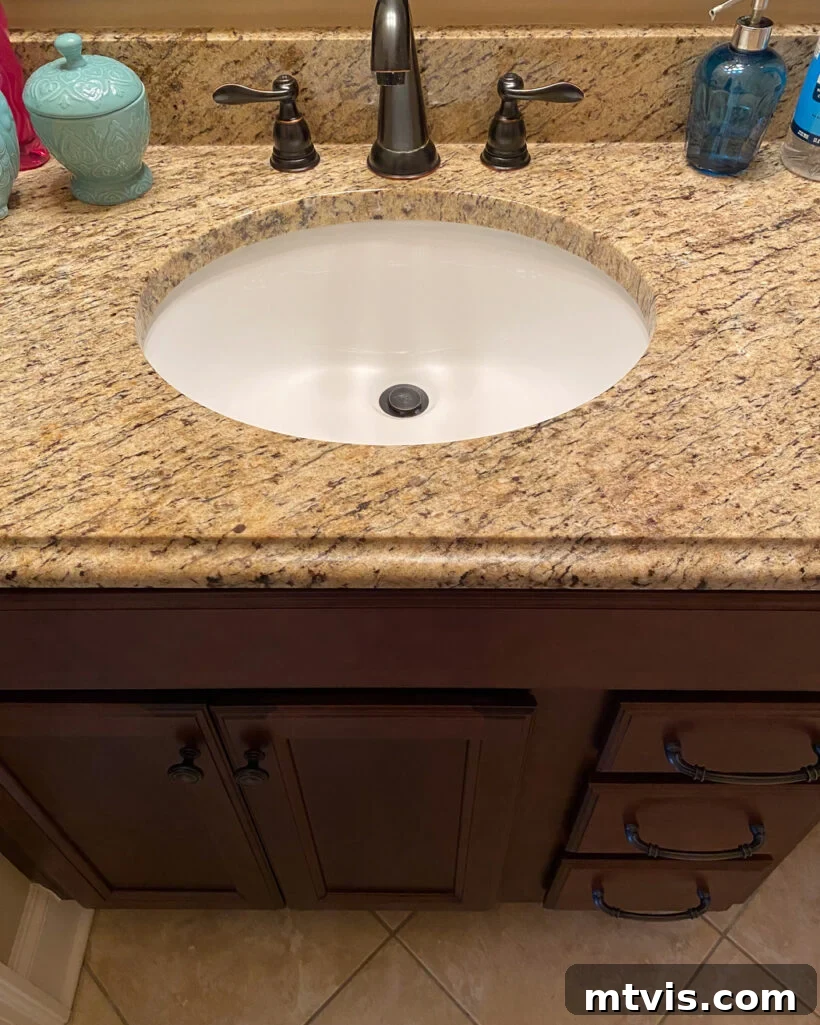 15+ Ingenious DIY Bathroom Renovation Ideas That Won't Break the Bank 5 brown vanity with brown granite in outdated bathroom before being painted