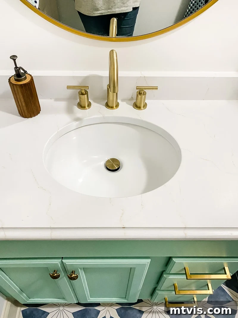15+ Ingenious DIY Bathroom Renovation Ideas That Won't Break the Bank 6 updated vanity with countertops painted to look like marble in girl's bathroom, showing a luxurious finish