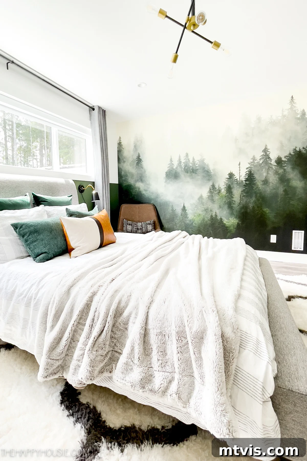 25 Creative Bedroom Transformations for Teenagers 25 An evergreen forest wall mural next to a bed covered in white blankets in a teen boy's sunny bedroom