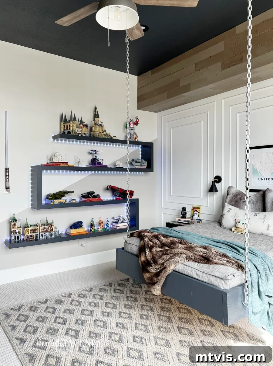 25 Creative Bedroom Transformations for Teenagers 26 A bed hanging from white chains is suspended over a grey rug. LEGO builds adorn floating zigzag lit shelves.