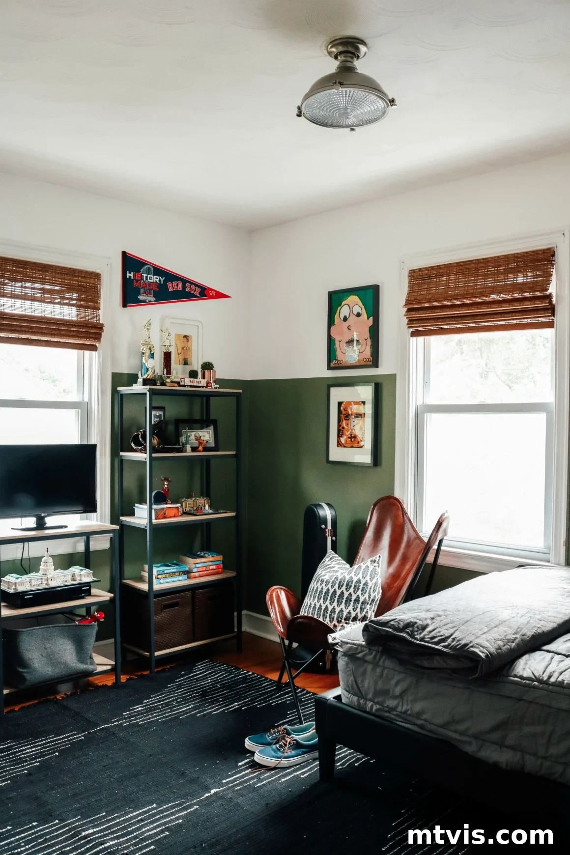 25 Creative Bedroom Transformations for Teenagers 28 A stylish, dark green teen boy bedroom has a dedicated gaming shelf with a bookcase in the corner.