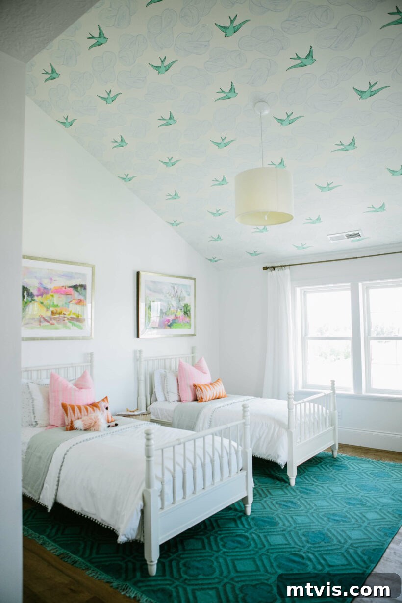 Brilliant Shared Kids' Bedroom Hacks 13 white girls' room with emerald green rug and wallpaper ceiling with clouds and birds