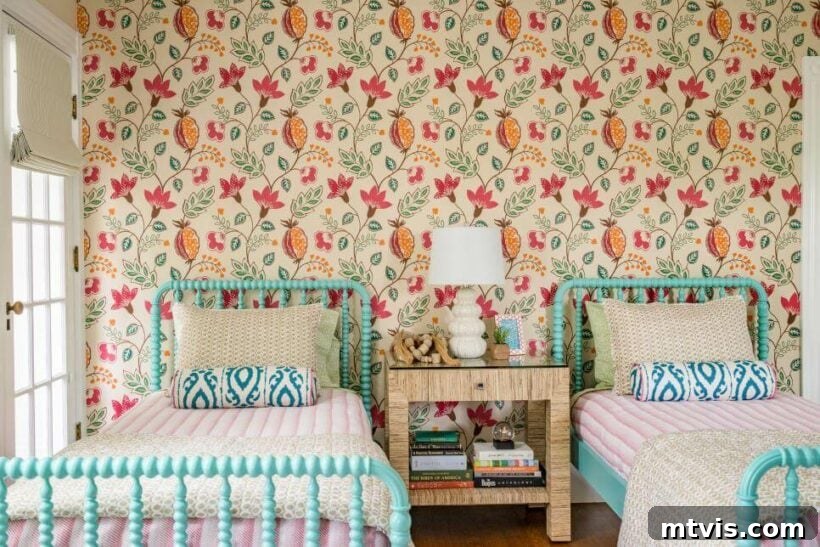 Brilliant Shared Kids' Bedroom Hacks 14 pink and orange floral print wallpaper with turquoise jenny lind beds and striped bedspreads