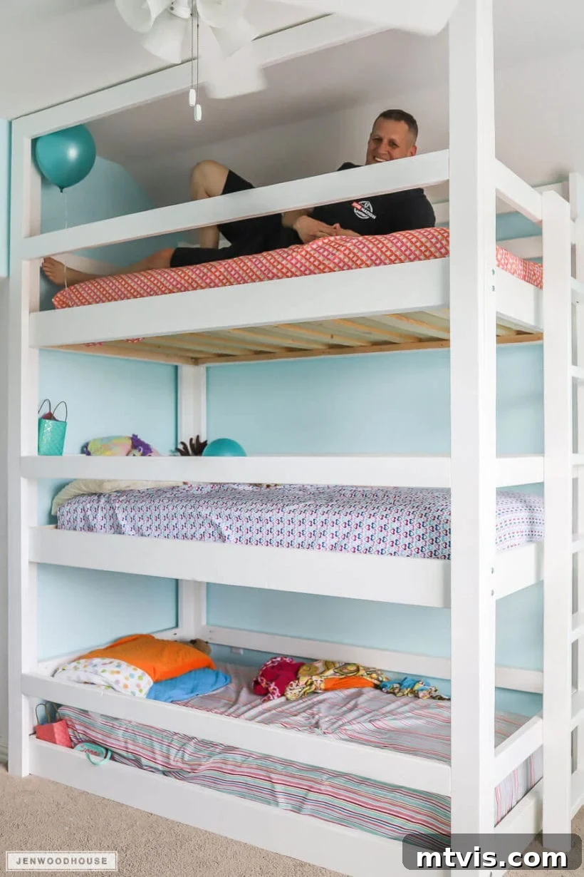 Brilliant Shared Kids' Bedroom Hacks 32 DIY triple bunk beds with man laying on the top one