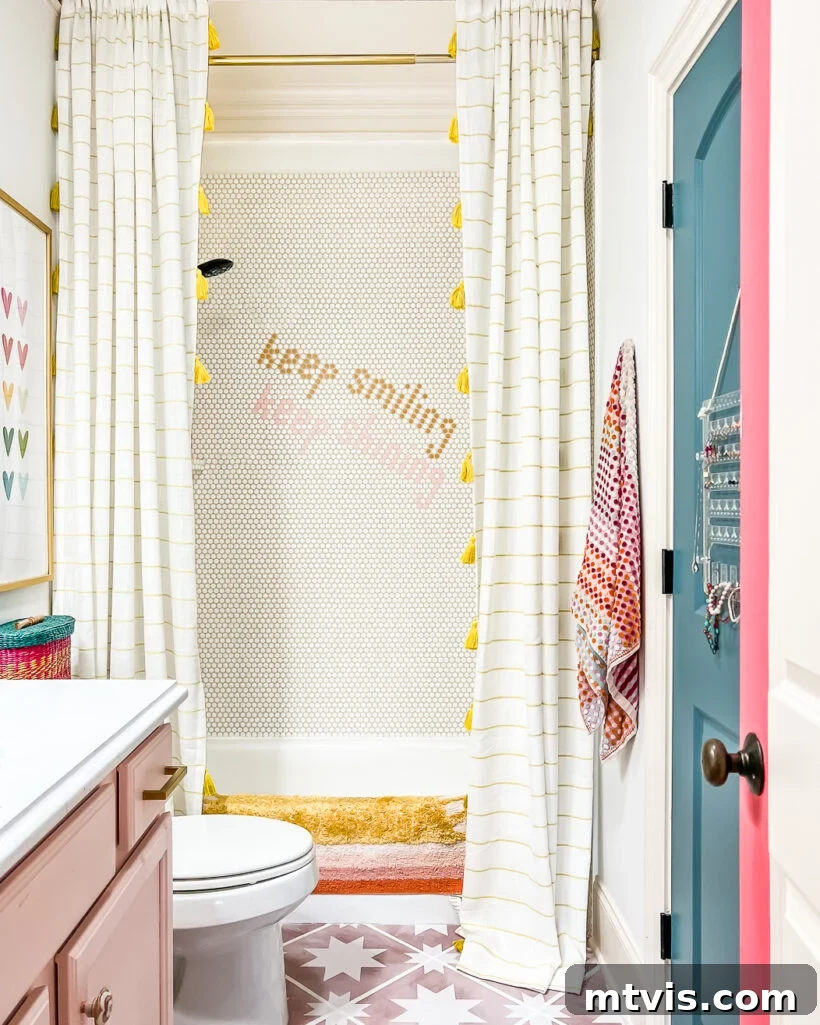 After photo of a girl's bathroom featuring a new penny tile shower installed over existing tiles, showcasing a modern transformation