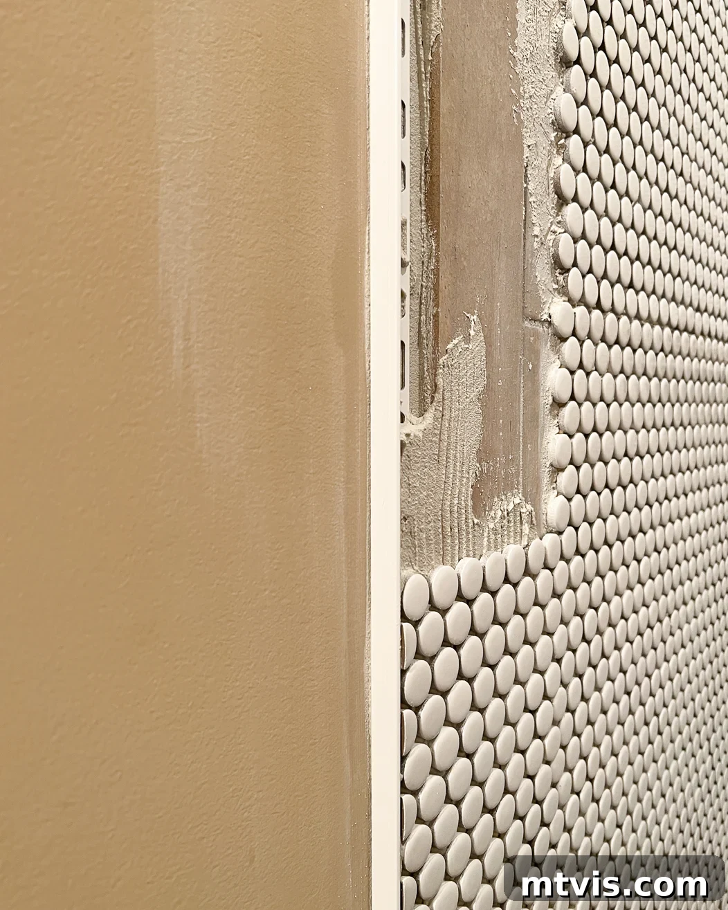 Close-up of a 1/2 inch Schluter edge trim piece, used for finishing the edges of tile-over-tile installations