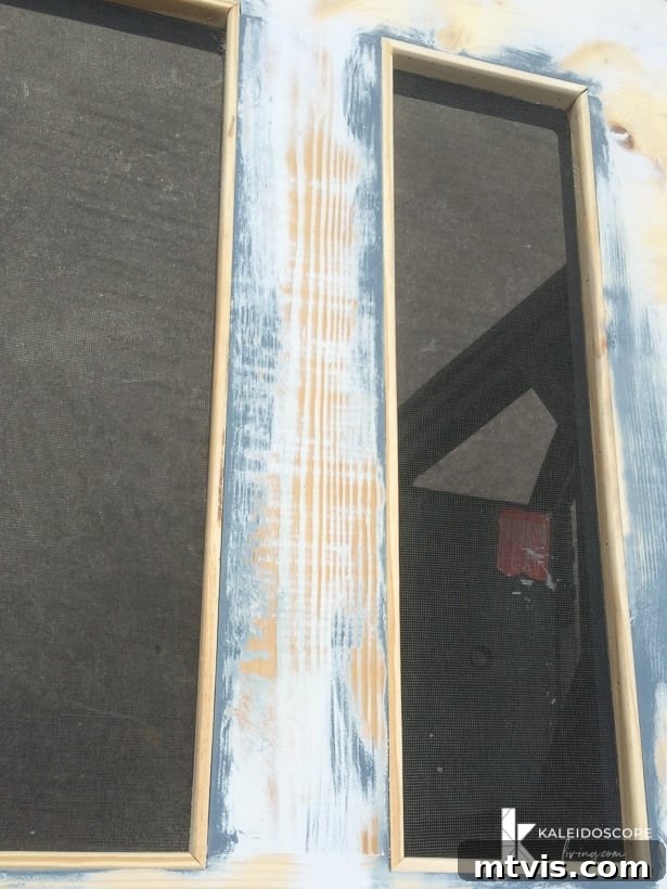 Craft Your Perfect Screen Door 11 Attaching screen molding to cover staples on the DIY screen door