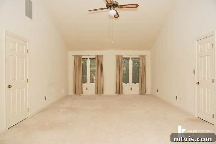 outdated, beige primary bedroom