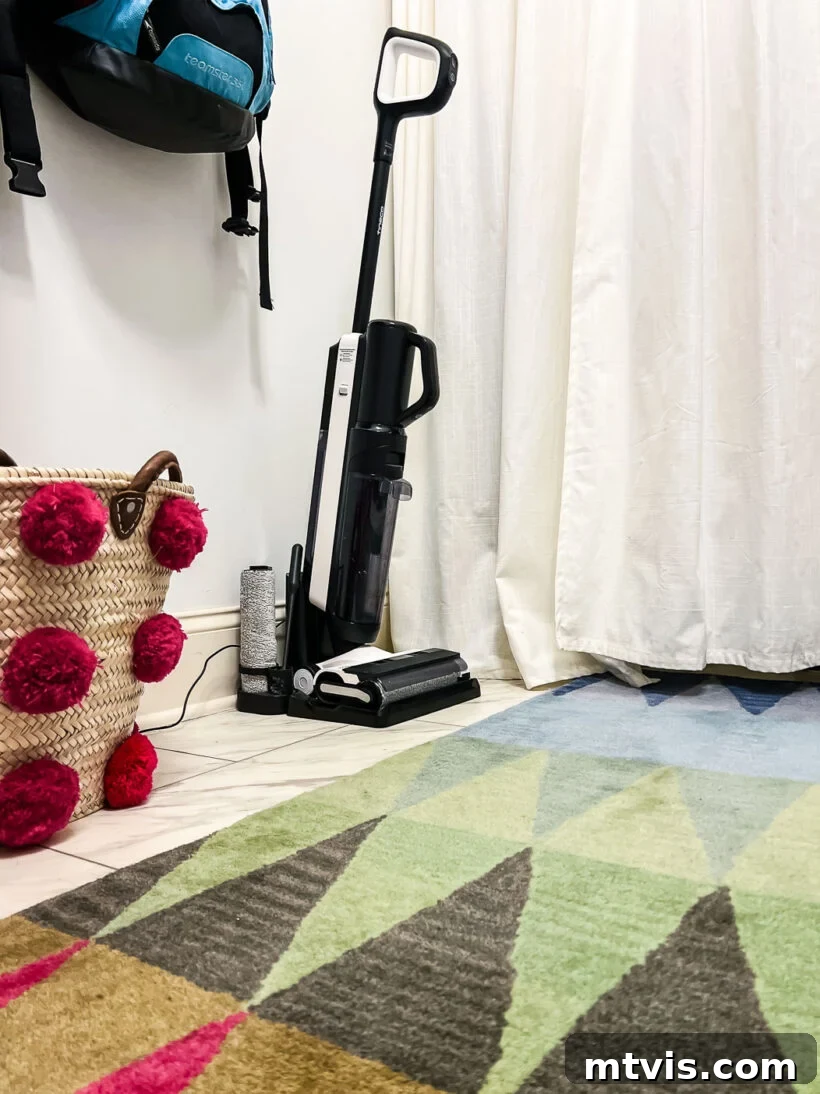 Tineco hard floor cleaner on charging dock in colorful laundry room