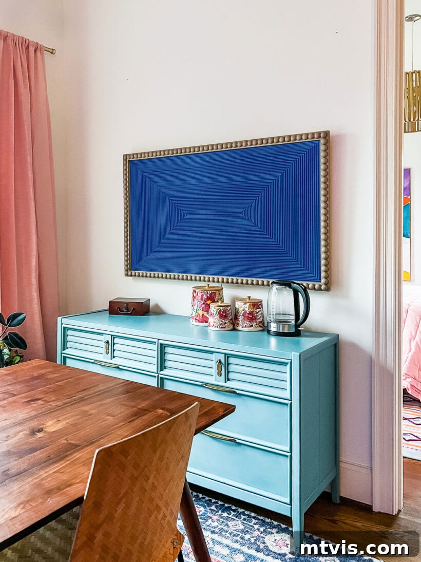 Build a Custom Frame for Your Television 15 A wider shot of the DIY framed TV integrated into a stylish kitchen corner