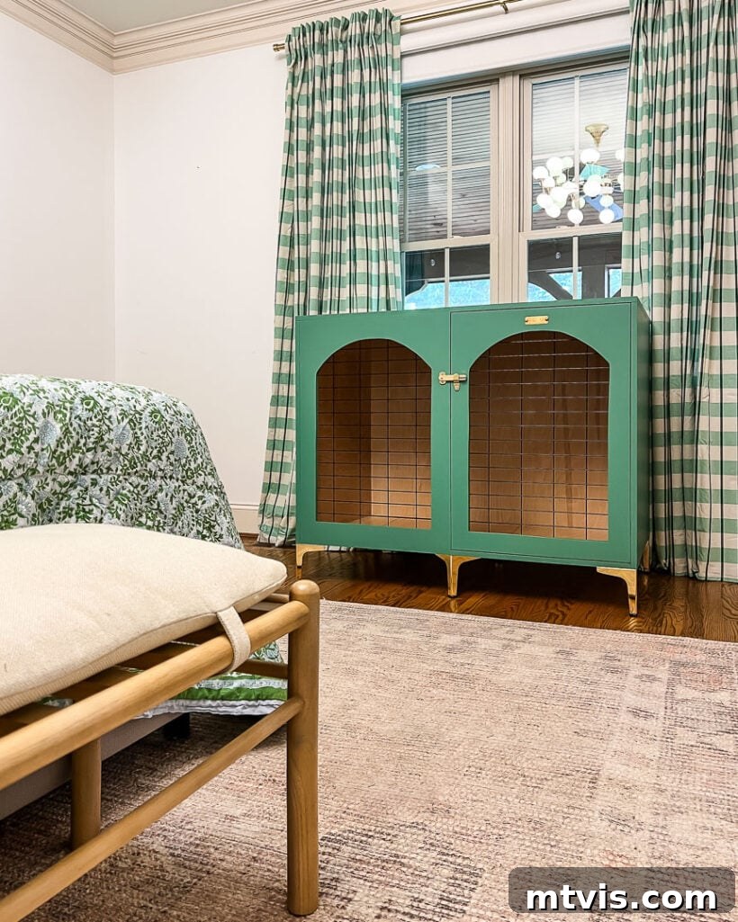A beautifully crafted DIY wood dog crate, designed to look like a piece of furniture, displayed within a green-themed bedroom, enhancing the room's aesthetic.