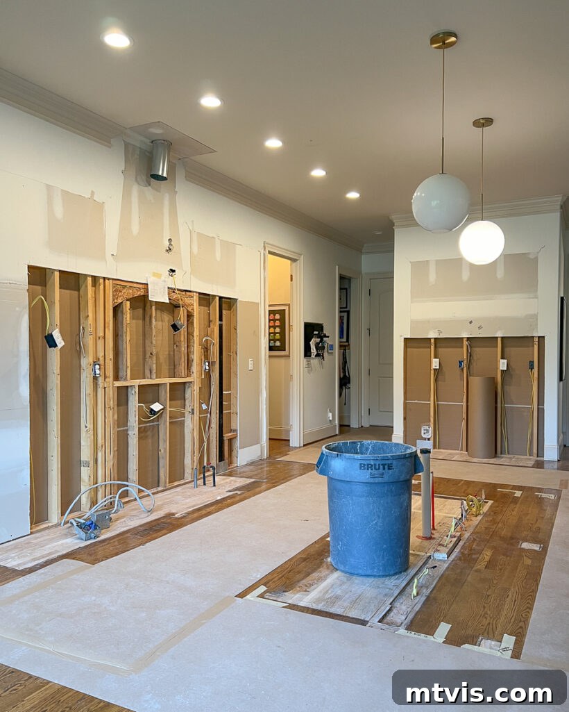 Kitchen Renovation Revealed: Our Decisions and the Dazzling New Layout 11 Photo of kitchen demolished and removed to prepare for renovation, showing construction phase