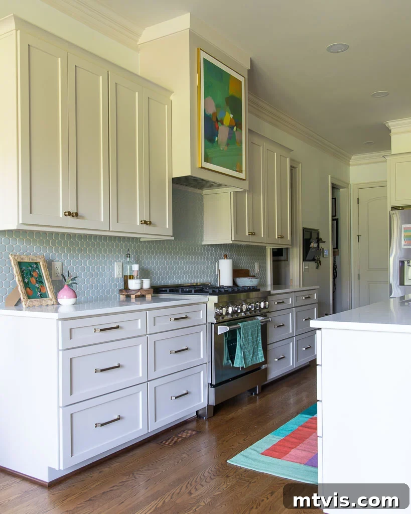 Our Kitchen Reveal: Serene Neutrals, Lively Hues 11 Interior view of a spacious kitchen drawer, showcasing organized utensils, cutlery, and spices, with a focus on smart and accessible storage solutions.