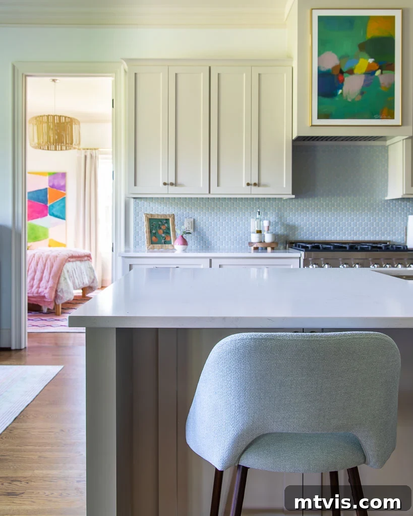 Our Kitchen Reveal: Serene Neutrals, Lively Hues 16 Close-up of a vibrant abstract art print by Eleanor Scott Davis, acting as a focal point and color anchor in the neutral kitchen, adding artistic flair.