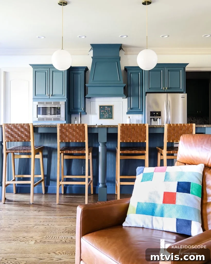 Our Kitchen Reveal: Serene Neutrals, Lively Hues 4 Colorful kitchen after a budget-friendly cosmetic makeover, featuring freshly painted cabinets and a refreshed backsplash, adding vibrant character.