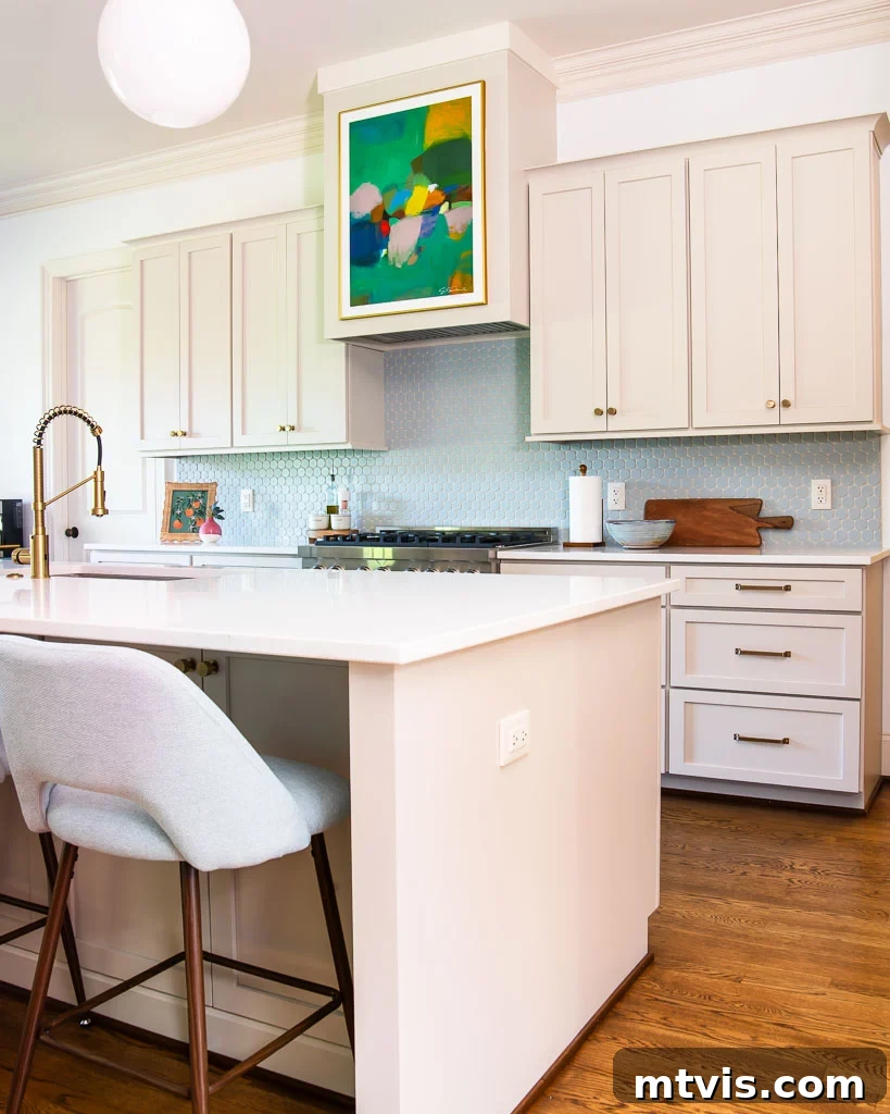 Our Kitchen Reveal: Serene Neutrals, Lively Hues 9 Spacious kitchen countertop in renovated kitchen, showcasing ample work surface and clean design, perfect for meal preparation and entertaining.