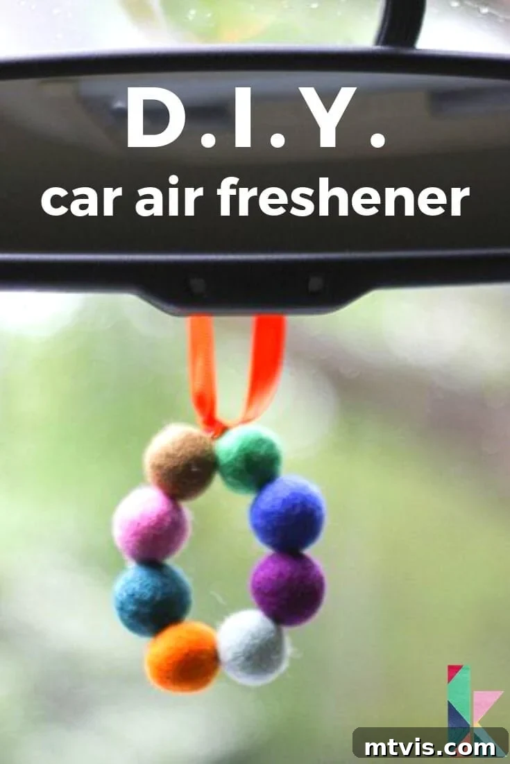 Homemade Pure Car Fragrance 2 A close-up of a circle of fuzzy felt balls hanging from a rear-view window act as a DIY car air freshener.