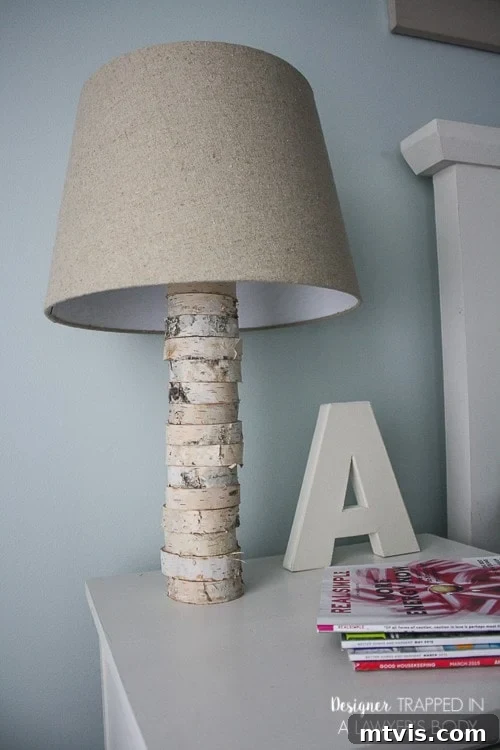 DIY Stacked Wood Lamp: Designer Style on a Budget 17 The completed DIY Anthropologie-inspired stacked wood lamp on a white table
