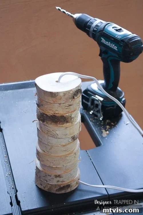 DIY Stacked Wood Lamp: Designer Style on a Budget 10 Multiple wood slices threaded onto the lamp cord, forming the lamp body
