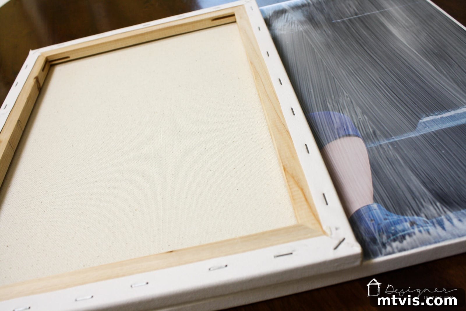 DIY Textured Photo Canvas Art 10 Using a smaller blank canvas to stamp texture onto the Mod Podge coated photo.