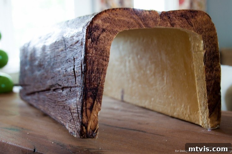 Achieve Stunning Ceilings Faux Wood Beam DIY 10 Uninstalled faux wood beam, showing its U-shaped, hollow construction.
