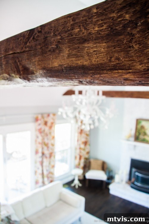 Achieve Stunning Ceilings Faux Wood Beam DIY 12 Newly installed faux wood beam, showing the completed rustic and elegant ceiling addition.