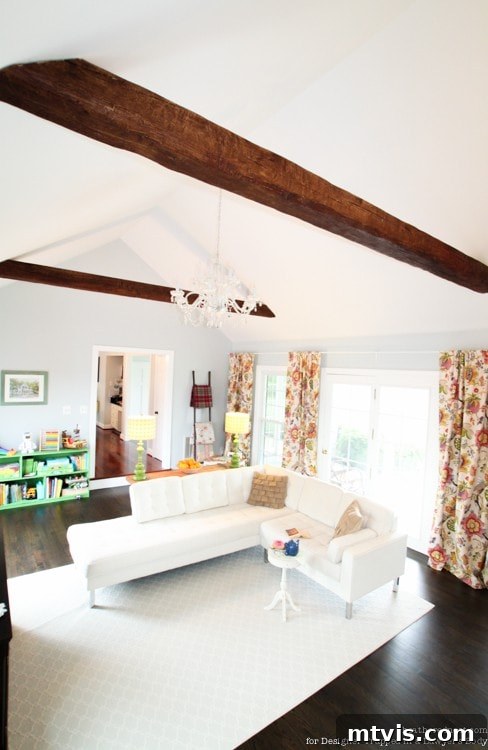 Achieve Stunning Ceilings Faux Wood Beam DIY 14 Beautifully completed living room with two newly installed faux wood beams on the cathedral ceiling.