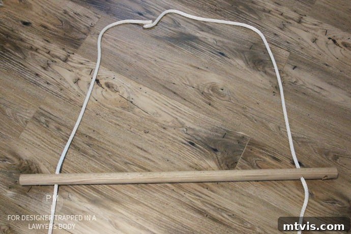 Craft Your Own Hammock Chair 15 Ceiling beam marked for drilling and eye bolt installation for a DIY hammock chair.