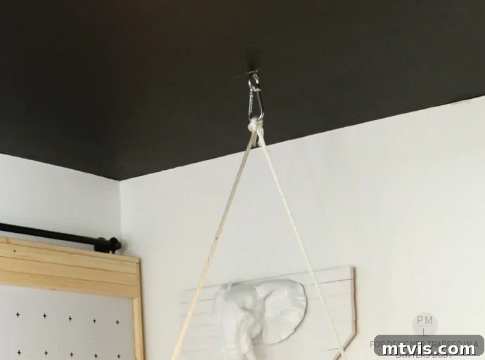 Craft Your Own Hammock Chair 17 Finished DIY hammock chair hanging in a stylish office, ready for relaxation.