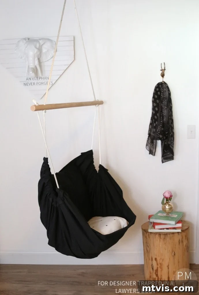 Craft Your Own Hammock Chair 19 Person enjoying the comfort of the DIY hammock chair in a brightly lit office space.