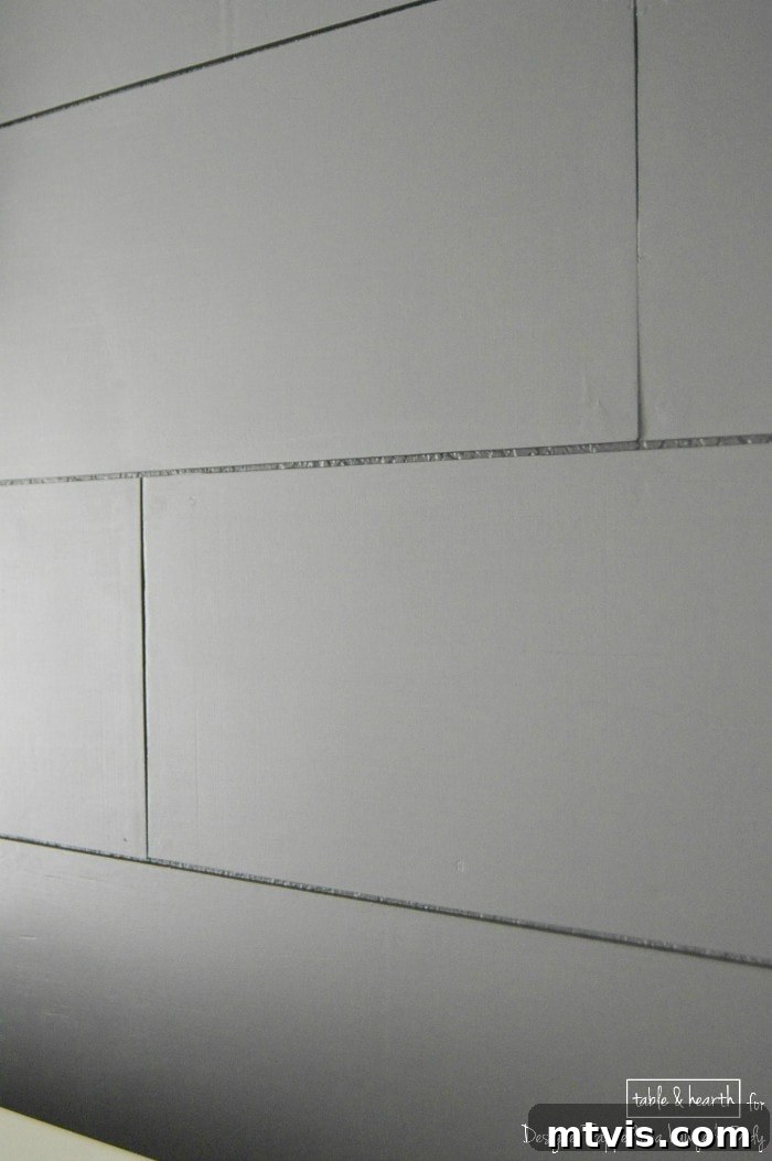 Build a Beautiful Wood Plank Accent Wall 11 Close-up detail of a DIY wood plank wall showcasing the wood grain and subtle texture