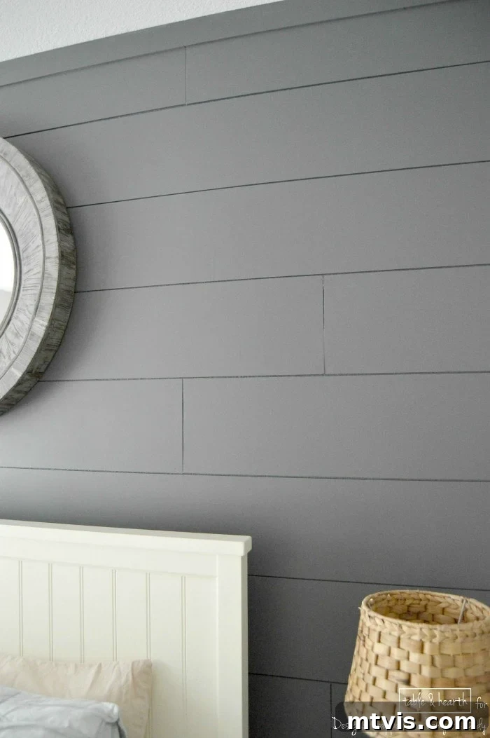 Build a Beautiful Wood Plank Accent Wall 12 Beautifully decorated guest room featuring the finished DIY wood plank wall
