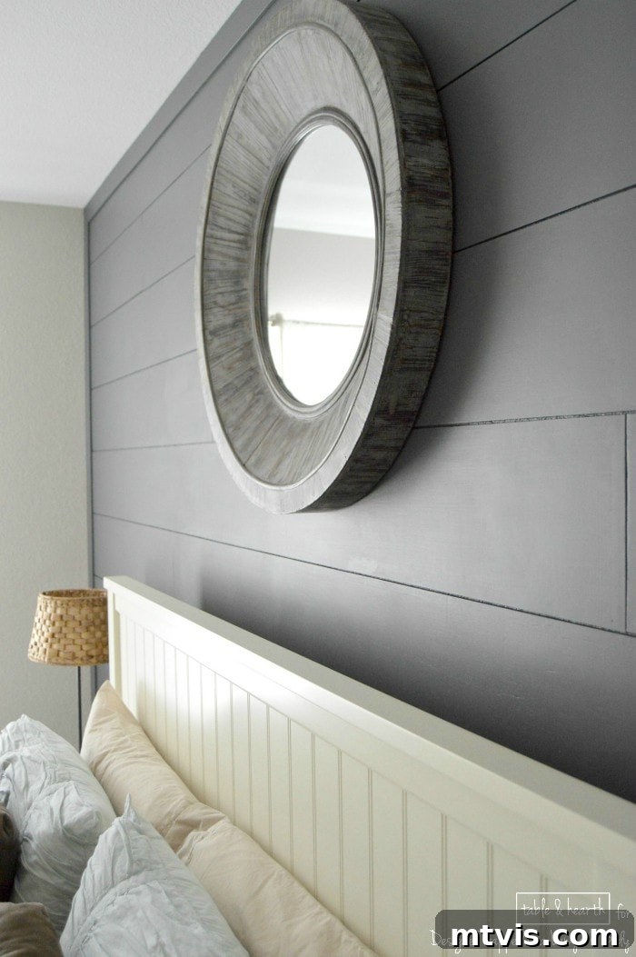 Build a Beautiful Wood Plank Accent Wall 15 Coastal-inspired guest room with a striking dark plank wall