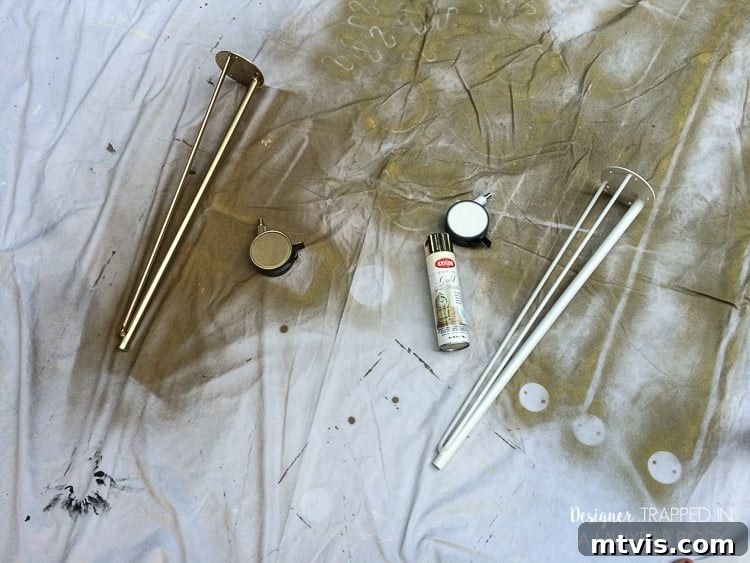 Effortless Ikea Desk Makeover 3 Spray painting IKEA Krille desk legs gold for a luxurious, custom DIY desk look. Applying multiple thin coats for an even finish.