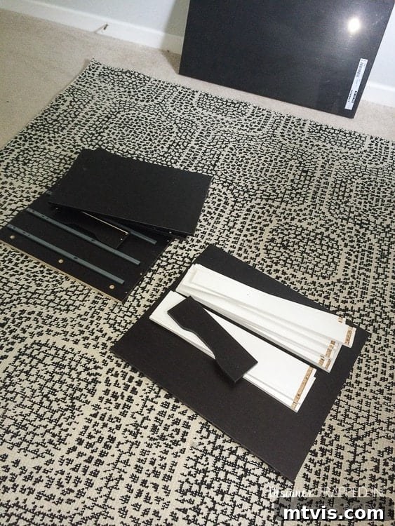 Effortless Ikea Desk Makeover 5 Assembling the IKEA Alex drawer unit, a key component for storage and support in this DIY desk hack.