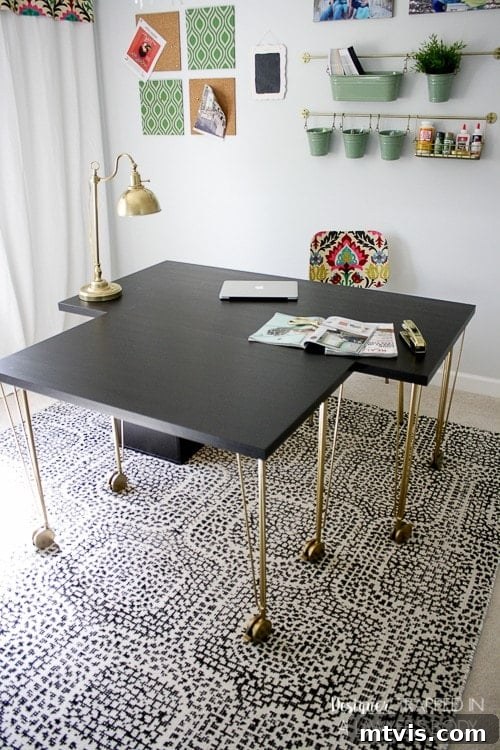 Effortless Ikea Desk Makeover 9 IKEA desk hack configured for a massive sewing or crafting workspace, combining two separate desks for ultimate flexibility.