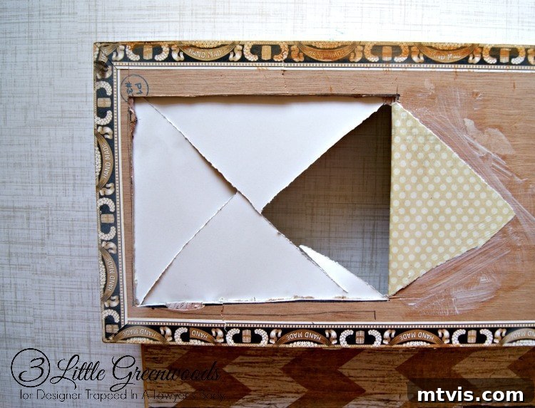 A clever trick for the inside: How to neatly finish the scrapbook paper around the phone jack cutout.