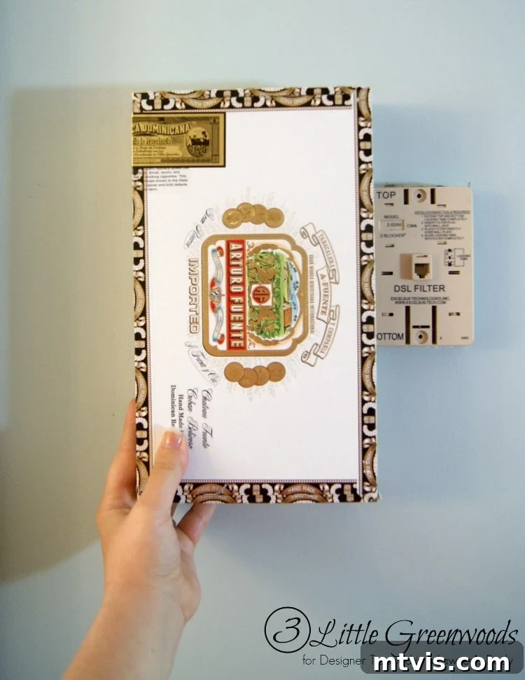Preparing your cigar box: The first step to creating a custom phone jack cover involves a precise cutout.
