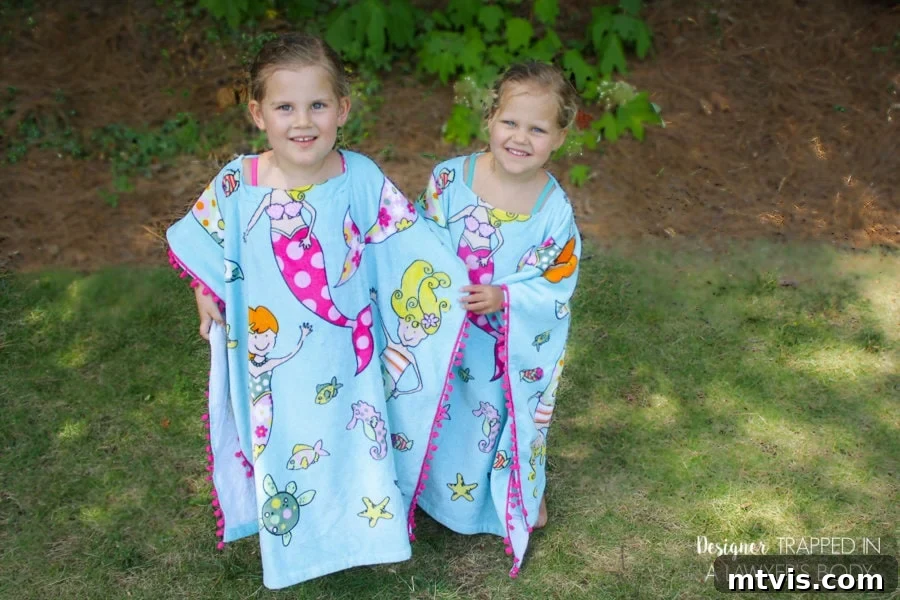 Upcycle Your Beach Towel into a Trendy Cover-Up 11 Close-up of a child wearing a colorful DIY beach towel cover-up with bright pom-poms.
