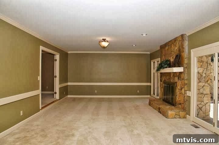 How Laminate Flooring Transformed Our Living Space 9 Before photo of an outdated family room with old flooring, awaiting transformation.