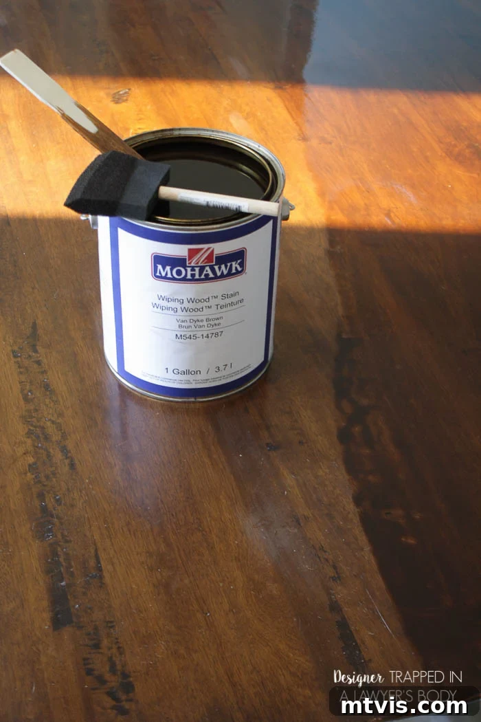 Easy Table Makeover: No Sanding, No Stripping 13 Applying Mohawk wood stain to a table with a foam brush
