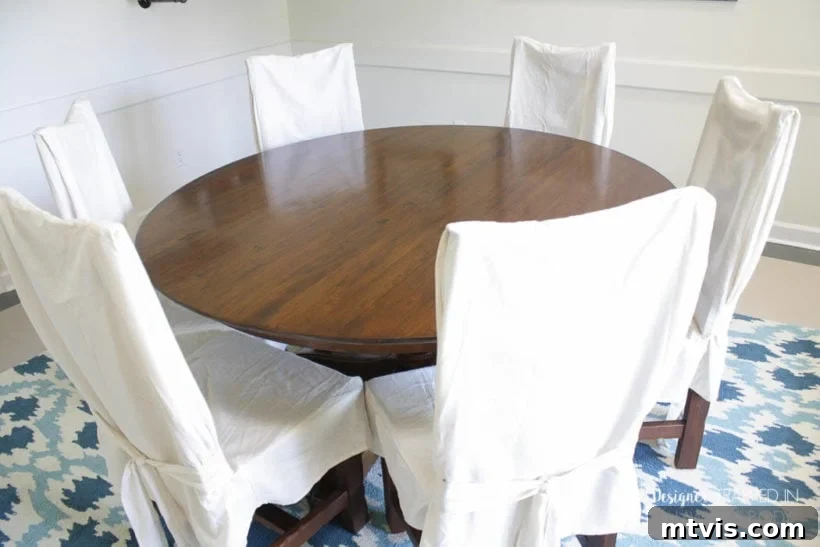 Easy Table Makeover: No Sanding, No Stripping 14 Refinished dining table with white chairs, looking brand new