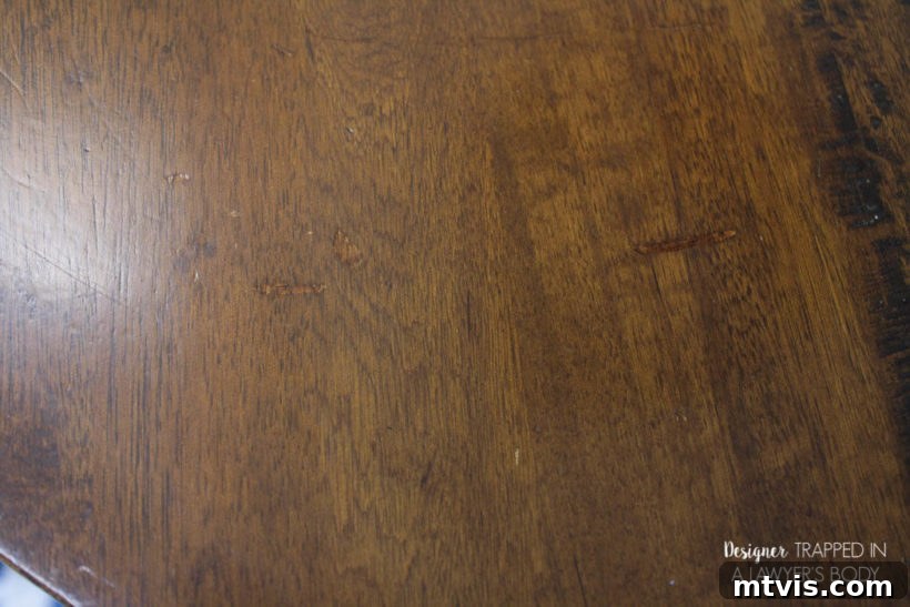 Easy Table Makeover: No Sanding, No Stripping 15 Close-up of a beautifully refinished wood tabletop, showing smooth repairs