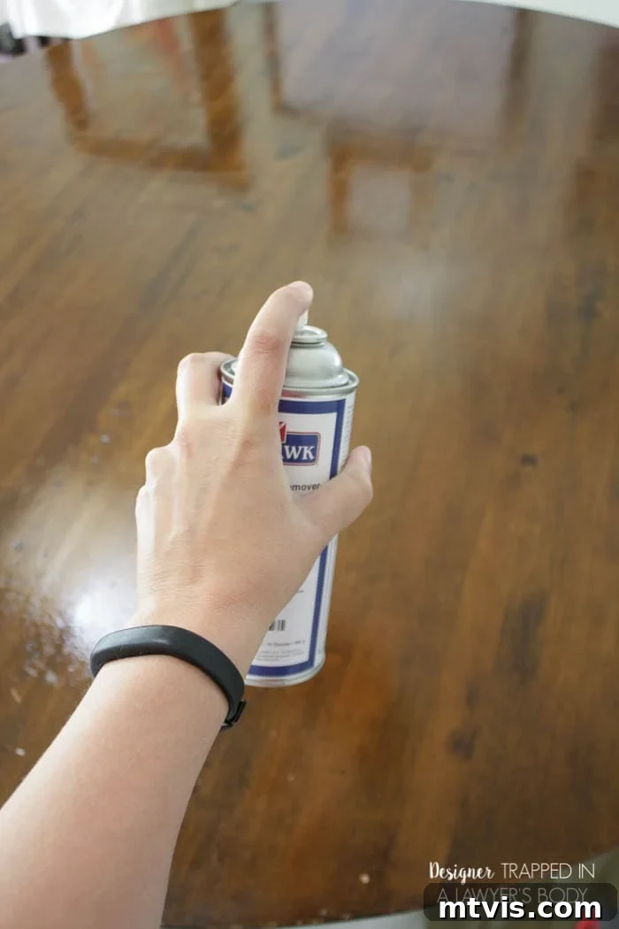 Easy Table Makeover: No Sanding, No Stripping 7 Spraying wood table with Mohawk Wax Wash Remover