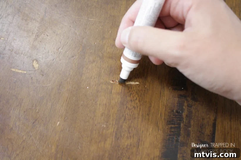 Easy Table Makeover: No Sanding, No Stripping 9 Filling in table scratches with a Mohawk touch-up marker