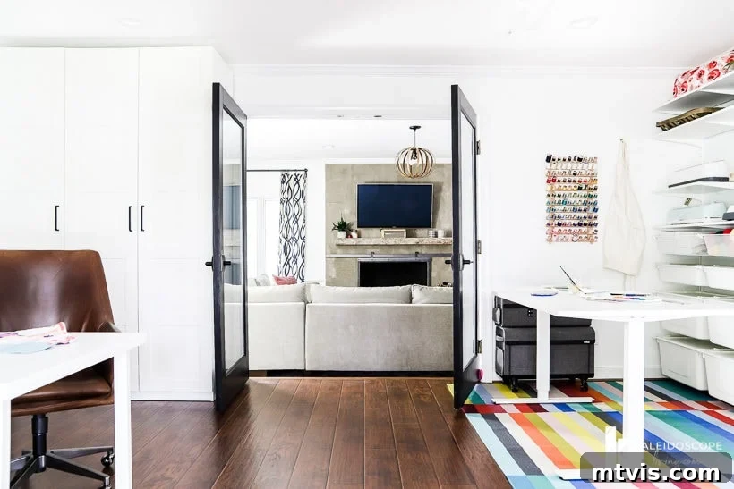 Stylish Concrete Fireplace Build for Under 100 14 The stunning 'after' view of the DIY concrete fireplace from an adjoining room, highlighting its clean lines and modern impact on the entire living space.